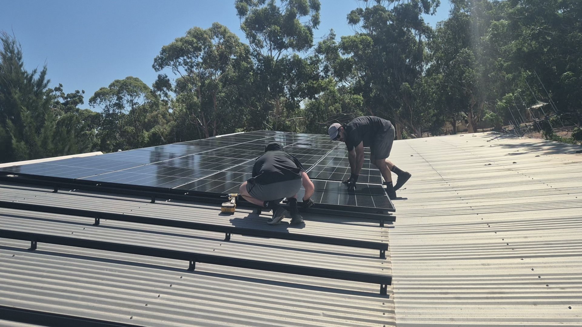 PSA installers working on a rooftop solar installation