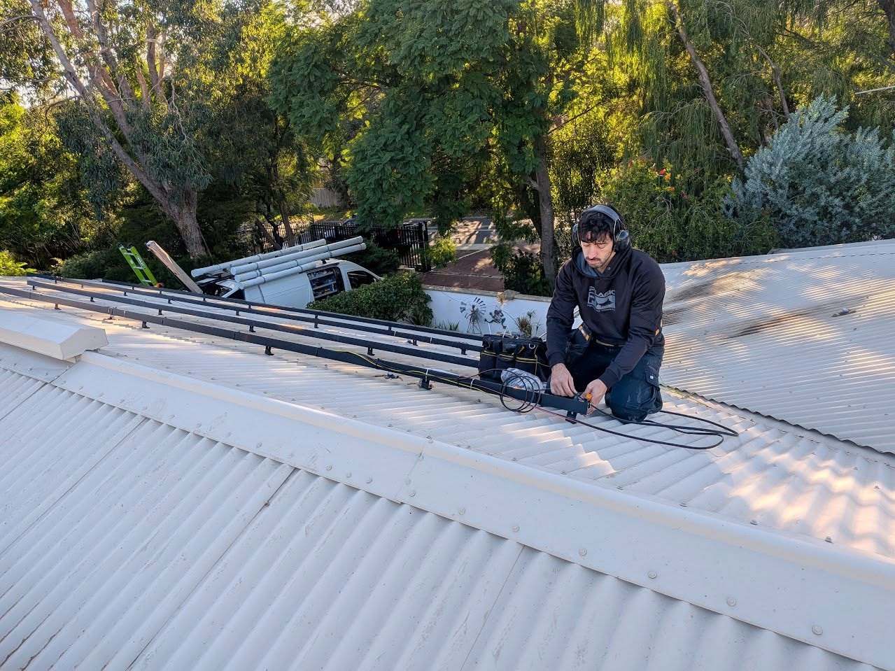 PSA installer preparing rooftop mounting rails